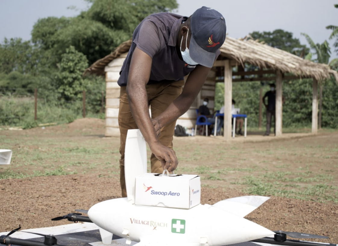 A person in a remote location receiving medical items by Swoop Aero drone