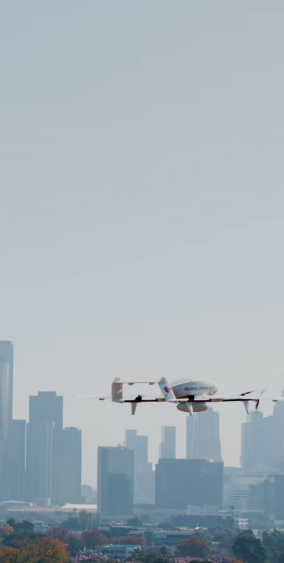 A Swoop Aero drone with a cityscape in the background